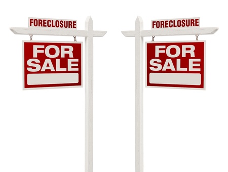 Pair of Left and Right Facing Foreclosure For Sale Real Estate Signs With Clipping Path Isolated on White.の写真素材