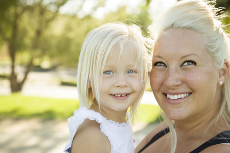 Cute Little Girl Having Fun With Her Mother Outside.の写真素材