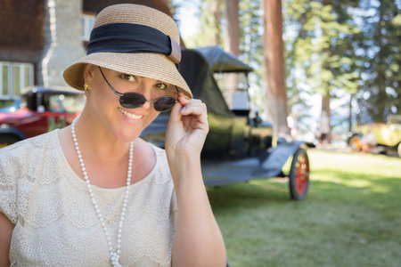 Beautiful 1920s Dressed Girl Near Vintage Car Outdoors Portrait.
