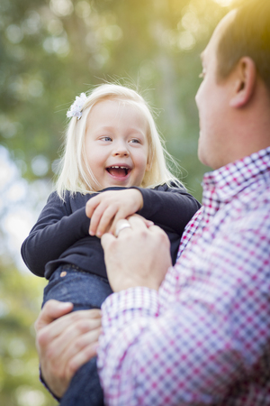 Adorable Little Baby Girl Having Fun With Daddy Outdoors.の写真素材