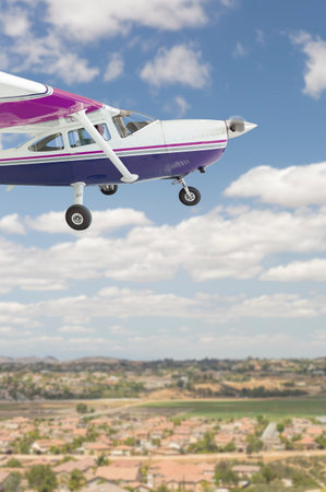 The Cessna 172 Single Propeller Airplane Flying In The Sky.