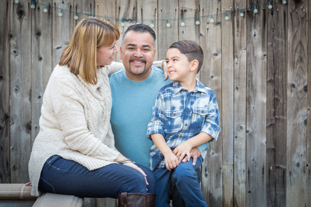 Happy Young Mixed Race Family Portrait Outside.の写真素材