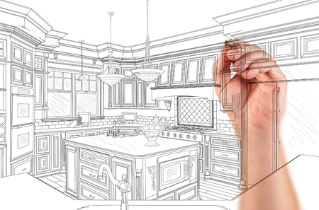 Hand of Architect Drawing Detail of Custom Kitchen Design.の写真素材