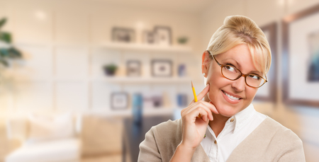 Beautiful Expressive Student or Businesswoman with Pencil in Office.の写真素材
