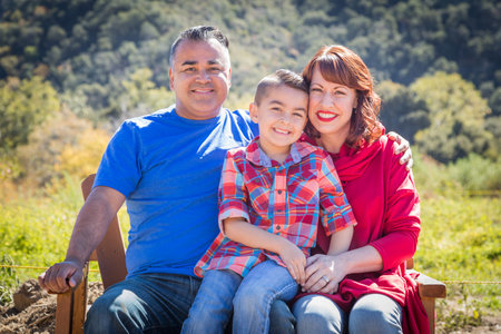 Mixed Race Caucasian and Hispanic Family At The Park.