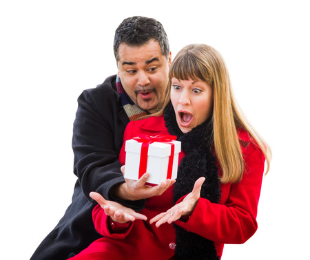 Mixed Race Couple Exchanging Christmas Gift Isolated on Whiteの写真素材