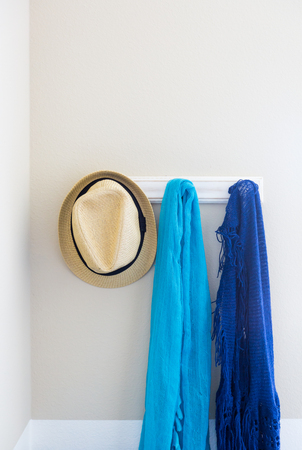 Wall in House with Hat and Scarfs Hanging on Coat Rack Hooks Abstract.の写真素材