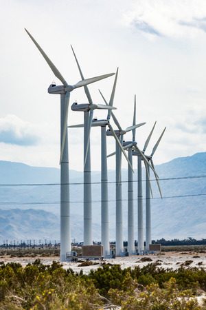 Dramatic wind turbine farm in the desert of California.の写真素材