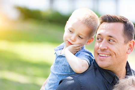 Young Caucasian Father and Son Having Fun At The Park.の写真素材