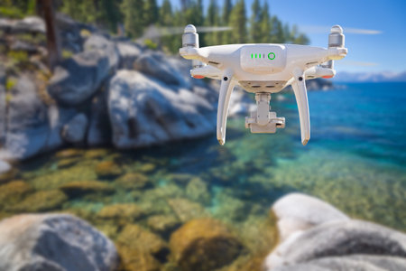 Back of Unmanned Aircraft System (UAV) Quadcopter Drone Flying Above Lake Tahoe