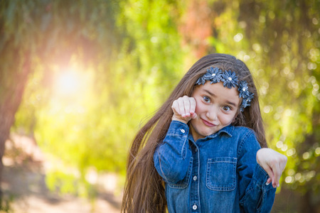 Cute Young Mixed Race Girl Having Fun Outdoors.の写真素材