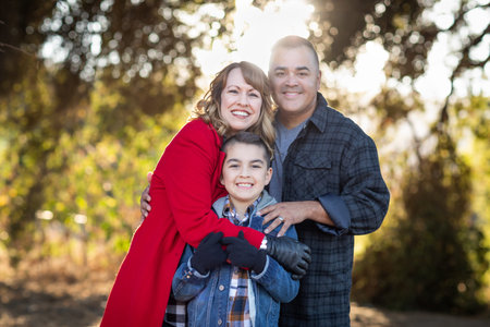 Mixed Race Family Portrait Outdoors.