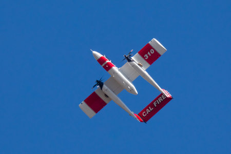 Winchester, CA USA - June 14, 2020: Cal Fire aircraft preparingto drop fire retardant on a dry...