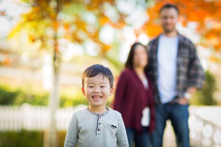Outdoor portrait of Multiethnic Chinese and Caucasian family.の写真素材