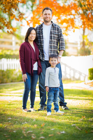 Outdoor portrait of Multiethnic Chinese and Caucasian family.の写真素材
