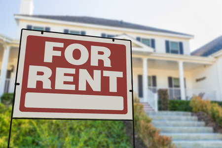 For Rent Real Estate Yard Sign In Front of House.の写真素材