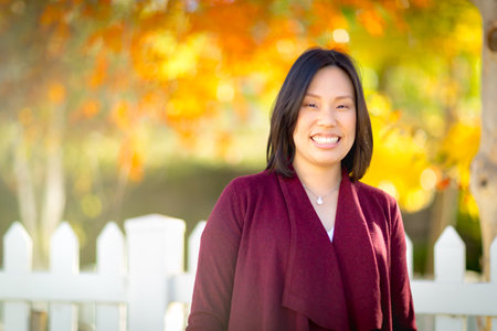 Pretty Chinese Woman Portrait in a Fall Setting.の写真素材