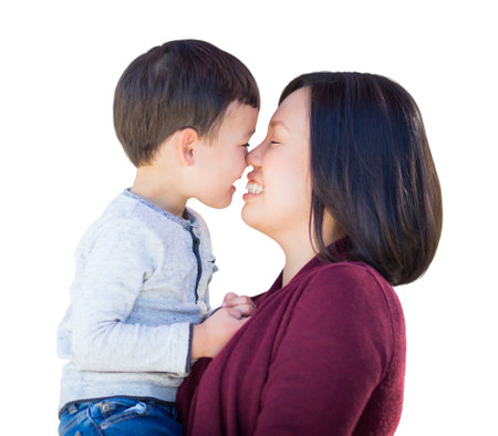 Chinese Mother and Mixed Race Caucasian and Chinese Son Portrait Isolated on a White Background.の写真素材
