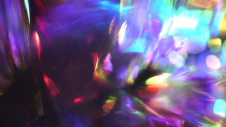 Holographic Abstract Multicolored Background for Christmas. Overlay, Rainbow Light Leaks Prism Colors, Defocused Effect, Blurred Glow. Purple pink blue gold colors rays and glowの写真素材