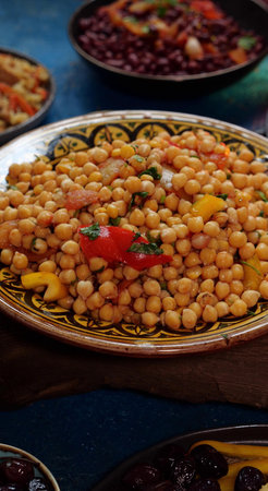 Traditional dishes for Ramadan - chickpeas with vegetables. Moroccan Cuisine dish table top