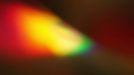 Rainbow light rays flash and glow. Abstract holographic background. Refraction of light through a...