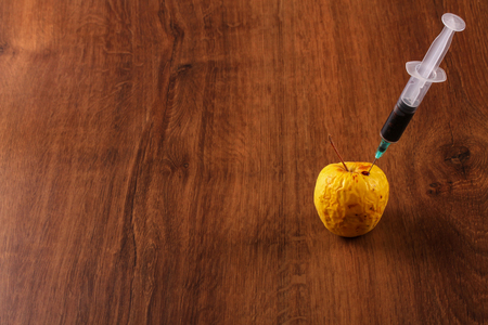 Hormone Apple on the Woodの写真素材