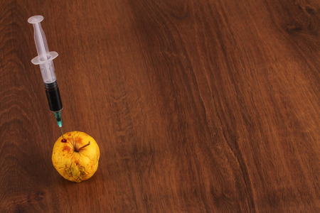 Hormone Apple on the Woodの写真素材