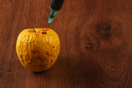 Hormone Apple on the Woodの写真素材