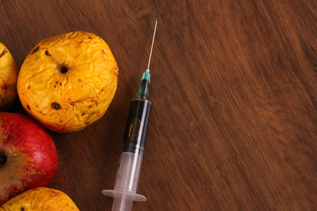 Hormone Apple on the Woodの写真素材