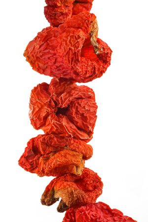 Dried red peppers on the white backgroundの写真素材