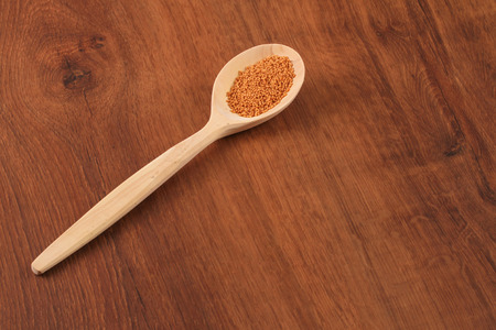 This is a very healthy herbal tea. The dry tea on the wooden spoon.の写真素材