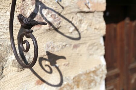 The decoration sparrow at the door in village.の写真素材