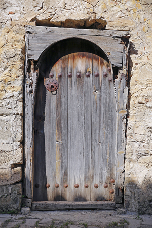 The antique door with old wall in Turkey.の写真素材