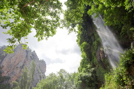 Waterfall with shining sun in Turkey.の写真素材