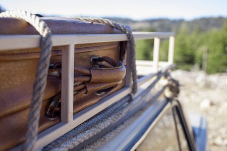 Old Suitcase on the old car in outdoor.の写真素材