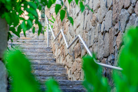 The rock wall mounted stair handrail.の写真素材