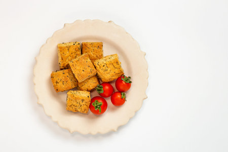 Dill cookies with cherry tomato on the plate white background.