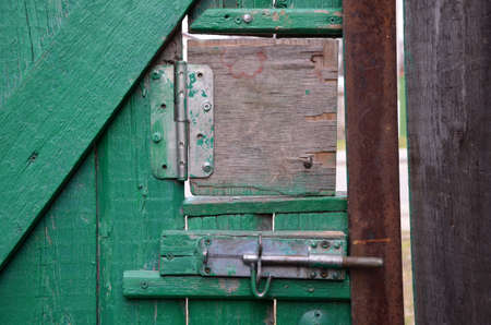 Wooden door with padlockの写真素材