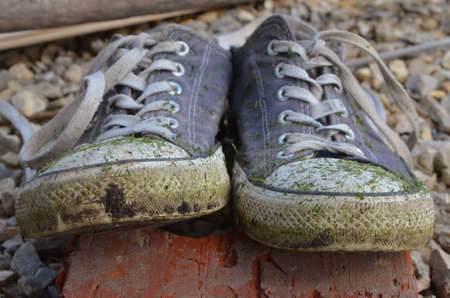 Dirt old sneakersの写真素材