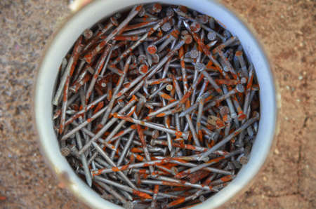 Rusty nails in tinの写真素材