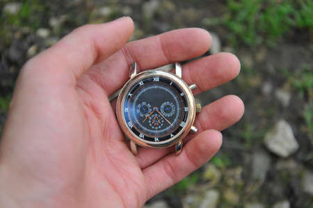 Retro dirty watch in man handの写真素材
