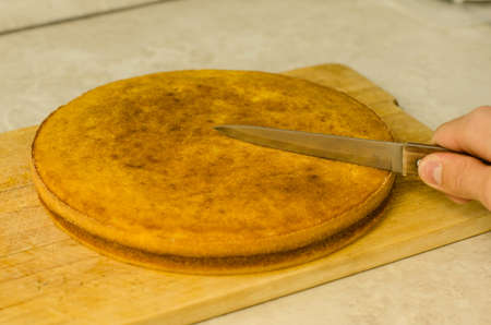cutting hot pumpkin pieの写真素材
