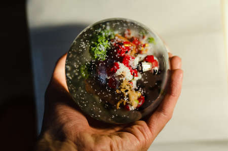 Glass snow ball red background xmas santaの写真素材