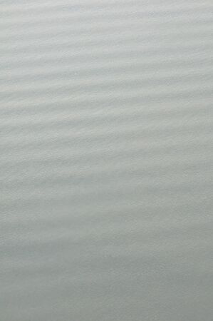 Rows of water waves from an airplane.の写真素材