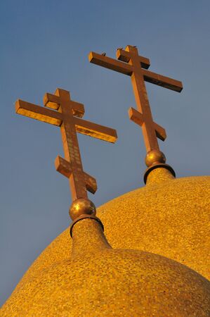 Two Russian orthodox church crosses against the skyの写真素材