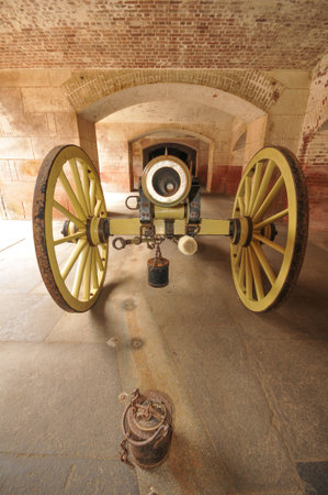 Old cannon on wheels points at viewerの写真素材