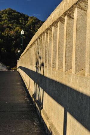 Old fashion bridge over a river with  light polesの写真素材