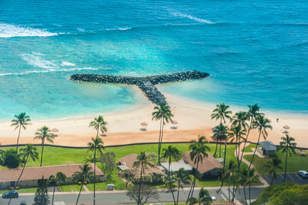 Sandy beach with mountains and ocean from an airplane jetの写真素材