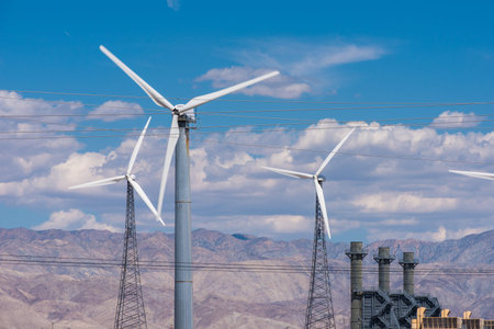 Arrays of solar panels and rows of wind turbines capture energy