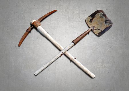 A shovel and pickaxe on the wall.の写真素材